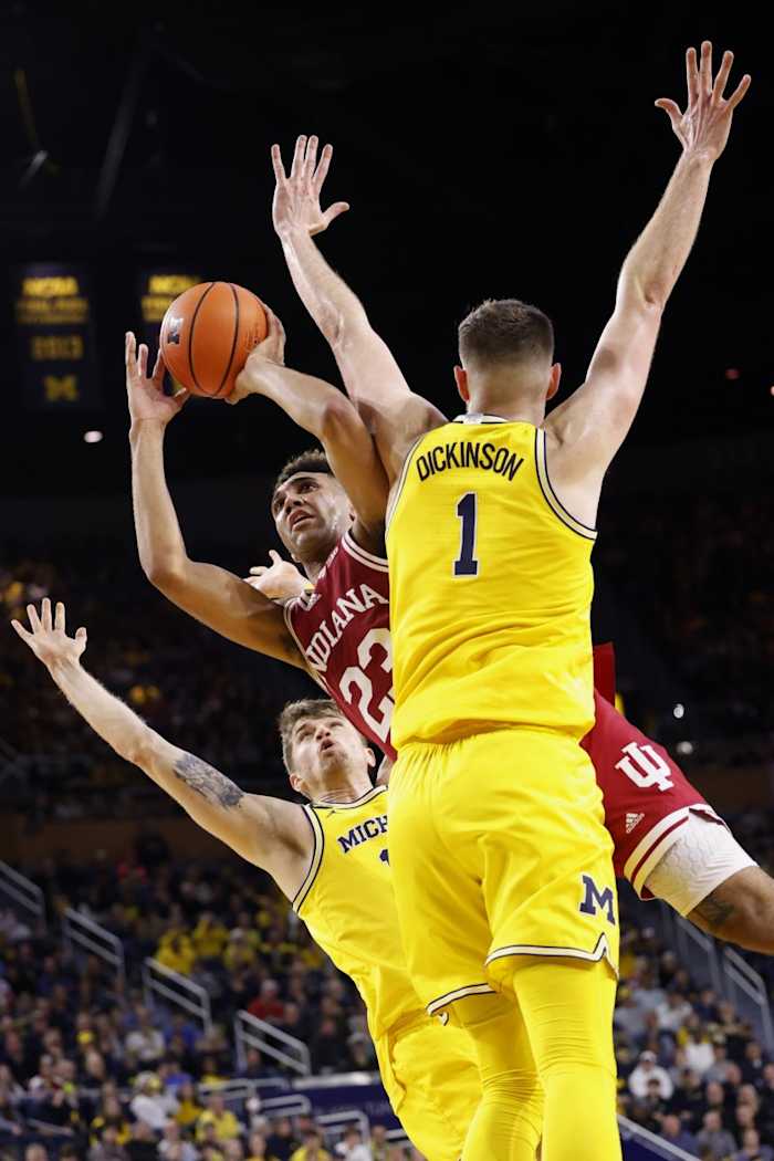Trayce Jackson-Davis (23) shoots on Michigan Wolverines center Hunter Dickinson (1) in the second half at Crisler Center.